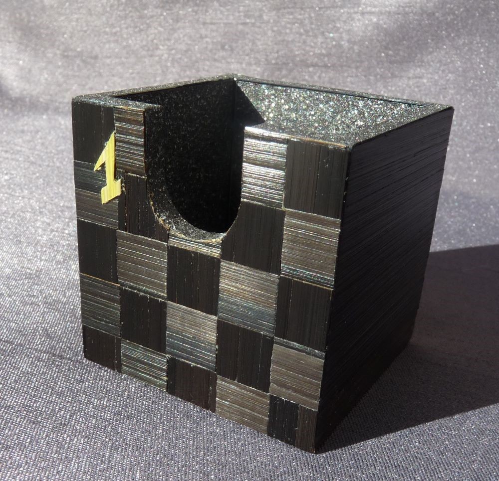 Avent Calendar with straw marquetry One day One pattern One color The first december Pattern : checkerboard (damier) Color : black (noir)